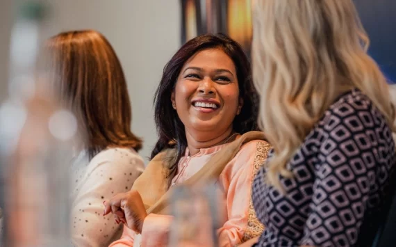 71688-women-gathered-talking-gettyimages-960289838.1200w.tn